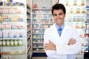 small business owner: portrait of a male pharmacist at pharmacy